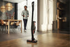 Miele Triflex HX1 Facelift Plus Cordless Vacuum (Obsidian Black) - 12206750 – person using cordless vacuum in room