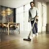 Miele Triflex HX2 Sprinter Cordless Vacuum (Cashmere Grey) - 12206770 – person using cordless vacuum in room