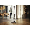 Miele Triflex HX2 Flash Cordless Vacuum (Lotus White) - 12206780 – person using cordless vacuum in room