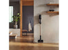 Miele Duoflex HX1 Total Care Cordless Stick Vacuum (Obsidian Black) - 12556680 – cordless vacuum stored against kitchen wall