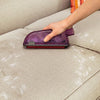 BISSELL Pet Hair Eraser Upholstery Tool 1604117 side close-up gathering hair on a couch without a hose