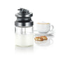 Miele MB-CVA 7000 Milk container made of glass — milk-filled container beside a coffee cup