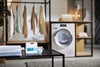Miele FA DF 152 L DryFreshTM fragrance flacon 12.5 ml — fragrance packaging in a laundry room