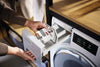 Miele WA CIP 0302 L ImpraProtect capsules — placing a capsule in the detergent drawer