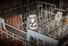 Miele DishClean & IntenseClean Set Dishwasher care set — DishClean container positioned in a dishwasher rack