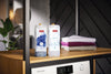 Miele WA UP2 1403 L NA UltraPhase 2 — UltraPhase cartridges beside folded laundry
