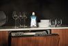 Miele GS RA 504 L RinseAid 500 mL — rinse aid bottle beside glassware