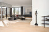 Miele Triflex HX3 Hardfloor Cordless Vacuum Casa Grey — wall-mounted storage in a living room