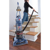 Hoover WindTunnel T-Series Pet Rewind Upright Vacuum UH70210 front view with hose in use for stair cleaning