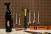 Metrovac Cordless Hand Vac – Part# 105-560005 – black hand vacuum stored on workshop pegboard