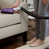 BISSELL Pet Hair Eraser Upholstery Tool 1604117 side view cleaning upholstery while connected to a vacuum hose