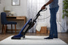 Riccar Tandem Air Premium Pet Upright Vacuum - R40P.8 – person using upright vacuum on floor
