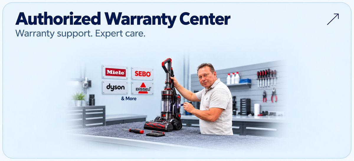 Authorized Warranty Center at Ace Vacuums — Joel inspecting an upright vacuum for warranty service and support.