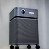 Austin Air Immunity Air Purifier Standard (Graphite) #B444D1 – graphite air purifier angled view against wall
