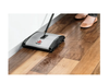 Bissell 2680 Push Sweeper (2 Brushes, Silver, 9.5 Inches) – Part #92N0A – sweeper picking up debris on wood floor