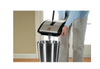 Bissell 2680 Push Sweeper (2 Brushes, Silver, 9.5 Inches) – Part #92N0A – sweeper being emptied into trash can
