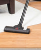 Bissell Zing® Bagless Lightweight Canister Vacuum – 2156A – floor nozzle cleaning wood floor beside rug