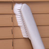 Crevice Brush Accessory gliding across a surface