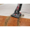 Dirt Devil Jaguar Pet Bagless Upright Vacuum UD70230 - angled nozzle view at a carpet and wood floor transition