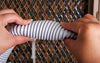 Electric Central Vacuum Hose shown as pliable and easy to handle