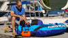 Metrovac MagicAir® Deluxe Inflator/Deflator Pump – Part# 109-118121 – pump inflating blue towable tube beside boat