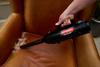Metrovac Cordless Hand Vac – Part# 105-560098 – black hand vacuum cleaning tan chair seam