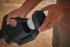 Miele HX-FDF 20 fine dust filter being removed from a Duoflex dust container
