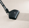 Miele SEB 213-2 electro floorhead attached to a wand and cleaning carpet
