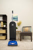 Blue Riccar R10E SupraLite Entry upright vacuum in a furnished room. Available at AceVacuums.