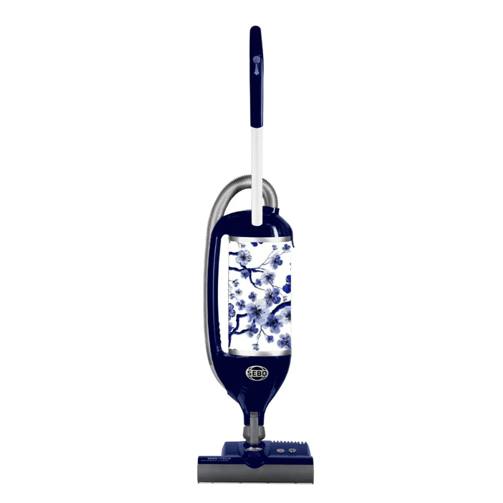 SEBO FELIX Premium Indigo upright vacuum model 90814AM with dark blue base, white housing, and indigo floral textile exhaust filter
