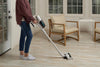 Simplicity Cordless Stick Vacuum – S67 – person vacuuming kitchen floor