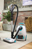 Simplicity Scout Plus Canister Vacuum – canister and floor head beside fireplace