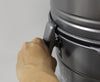 Unlatching the VacuMaid P110 dirt canister for emptying