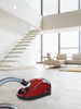 Miele Compact C1 HomeCare PowerLine STB-305 - SCAO3 - 10850050 – red canister in a bright room
