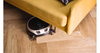 Miele Scout RX3 Home Vision Vacuum - 11830100 – robot vacuum cleaning beneath a sofa