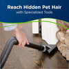 Bissell CleanView Swivel Rewind Pet Vacuum Cleaner – 2256 – hand tool cleaning beside fireplace