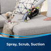 Bissell Pet Stain Eraser Plus #3182 – handheld cleaner treating sofa upholstery